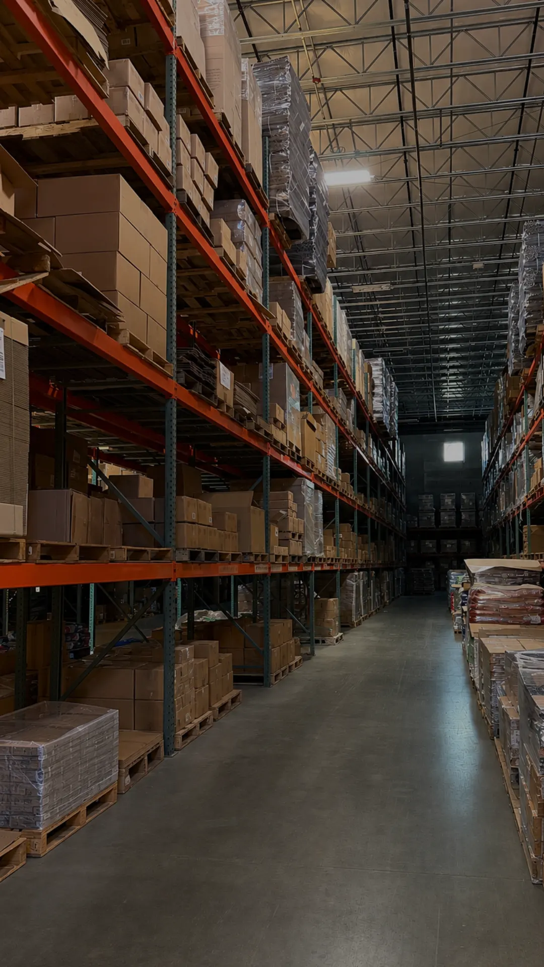 Racking aisle holding corrugate and boxed inventory